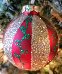 Red ornament with wide gold stripes & green swirls- shatterproof 3"