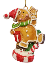 Load image into Gallery viewer, Gingerbread Resin Ornament Wearing Santa Hat with Presents  3&quot;
