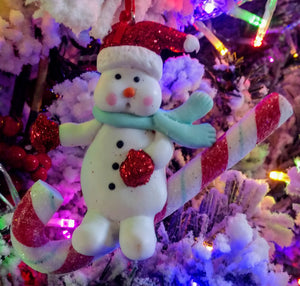 Snowman ornament with Santa hat/ candy cane - resin 4"