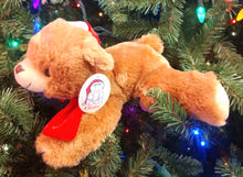 Load image into Gallery viewer, Plush Brown Bear Laying Down with Red Santa Hat &amp; Red Scarf 11&quot;x5&quot;
