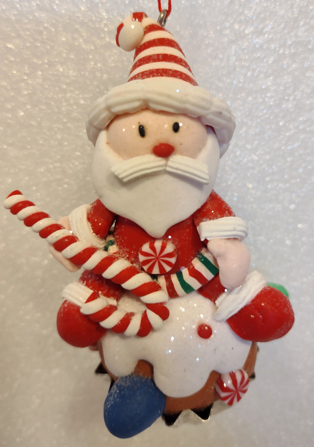 Clay dough Santa Sitting on a Gingerbread Cupcake Ornament 3.5