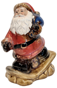 Ceramic Santa Figurine On Snowboard or Skis