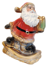 Load image into Gallery viewer, Ceramic Santa Figurine On Snowboard or Skis
