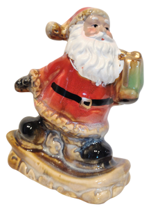 Ceramic Santa Figurine On Snowboard or Skis