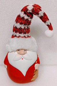Santa Figurine with Red/White Hat Holding Christmas Tree